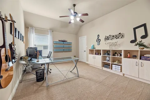 a bedroom with a bed a chair and a chandelier
