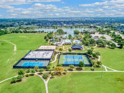 an aerial view of ocean residential houses with outdoor space and swimming pool