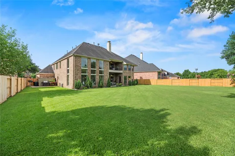 a view of a house with a big yard