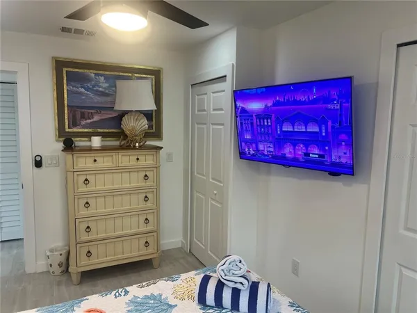 a room with a dresser and a mirror