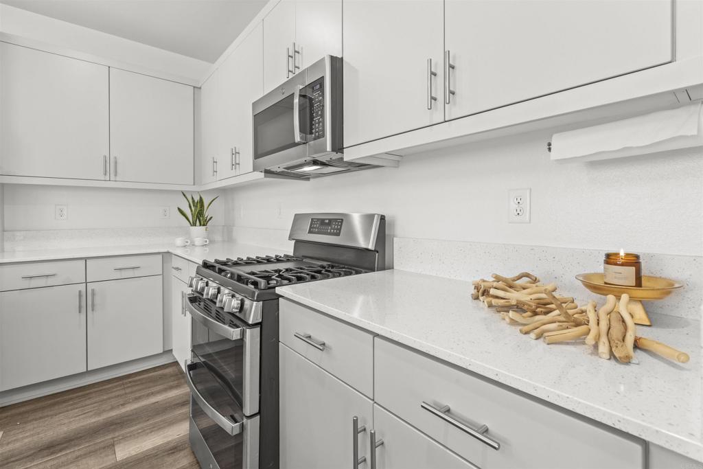 323 Citrine Trail Fallbrook, CA 92028 - Photo 13 of 21 a kitchen with stainless steel appliances granite countertop a sink and a stove