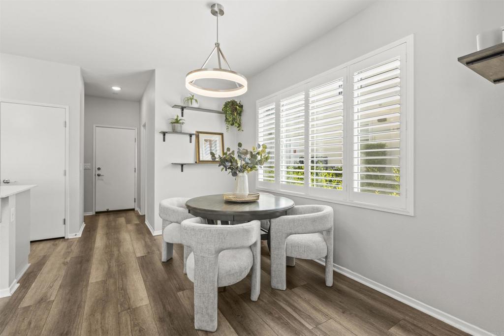 323 Citrine Trail Fallbrook, CA 92028 - Photo 15 of 21 a view of a dining room with furniture window and wooden floor