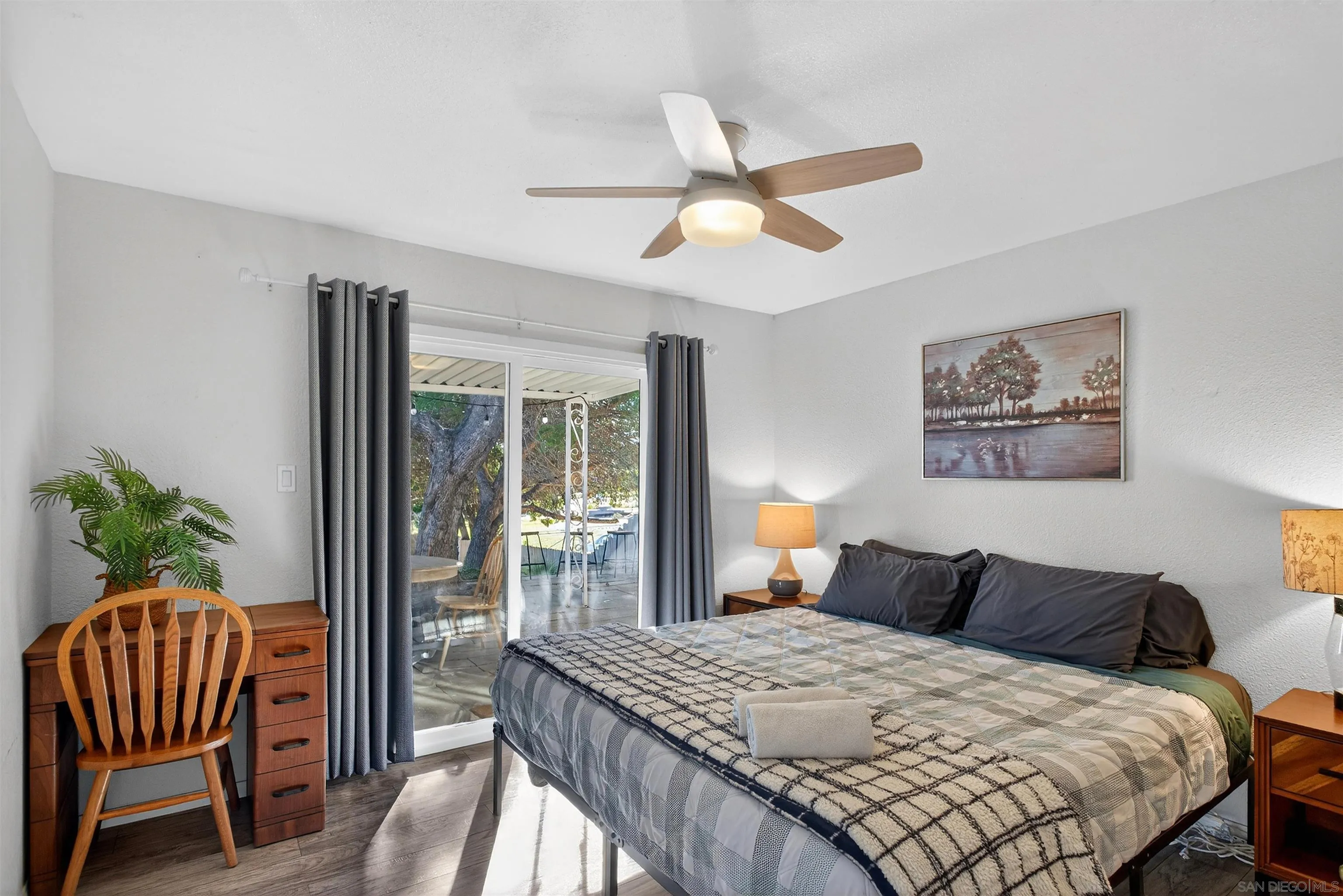 3548 De Leone Road San Marcos, CA 92069 - Photo 23 of 46 a bedroom with a bed and a chandelier