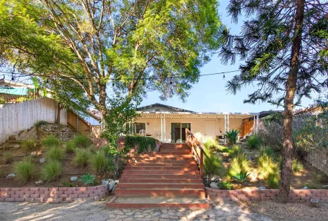 a view of a house with a yard