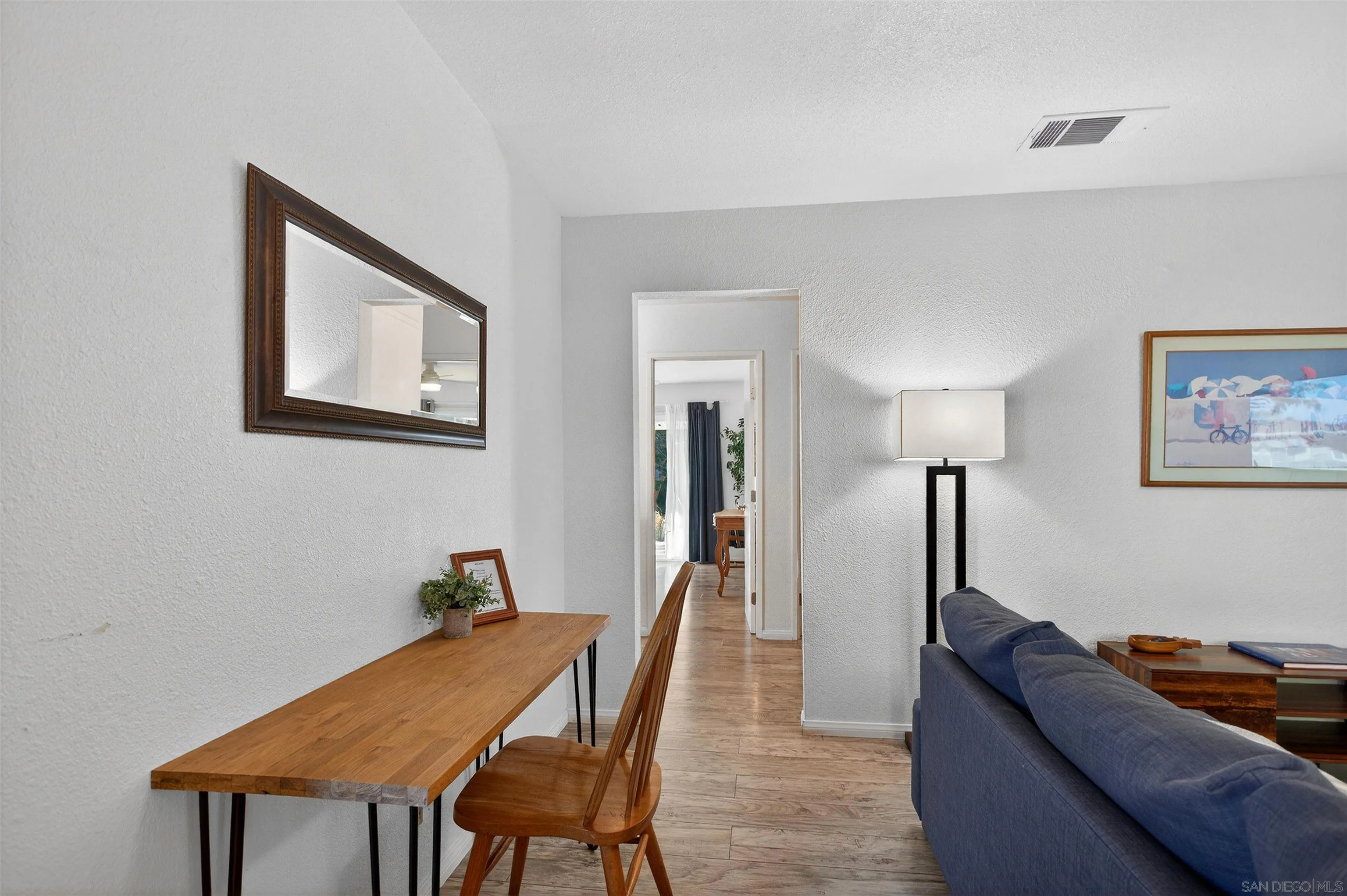 3548 De Leone Road San Marcos, CA 92069 - Photo 9 of 46 a living room with furniture and a lamp