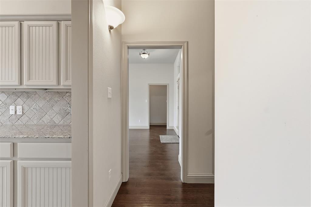 2512 Guinn Farms Road Tyler, TX 75707 - Photo 22 of 29 a view of a hallway with wooden floor