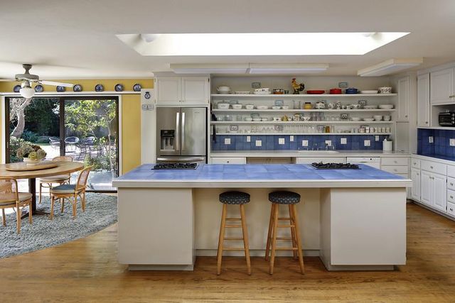 a view of living room with stainless steel appliances granite countertop furniture and rug