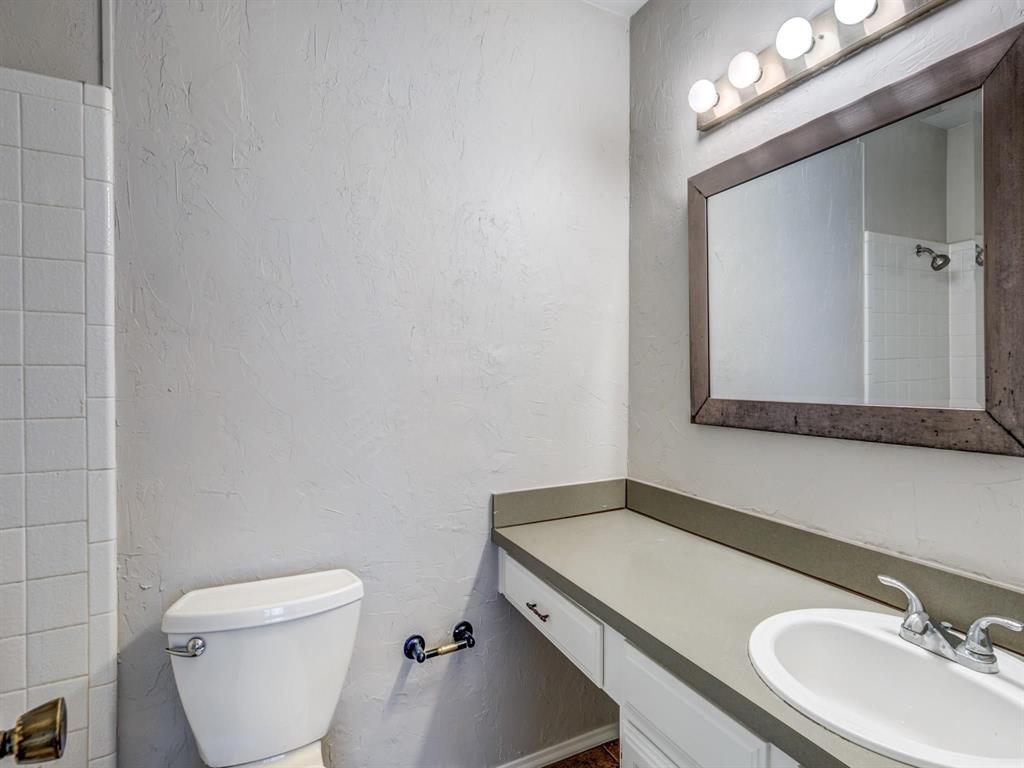 5626 Preston Oaks Road, Unit 39C Dallas, TX 75254 - Photo 10 of 38 Bathroom with a textured wall, vanity, and a shower