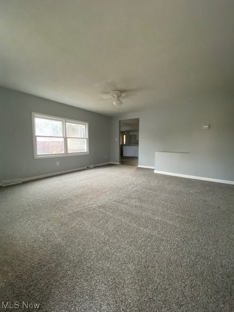 2216 Pressler Road Akron, OH 44312 - Photo 11 of 29 Carpeted spare room with ceiling fan
