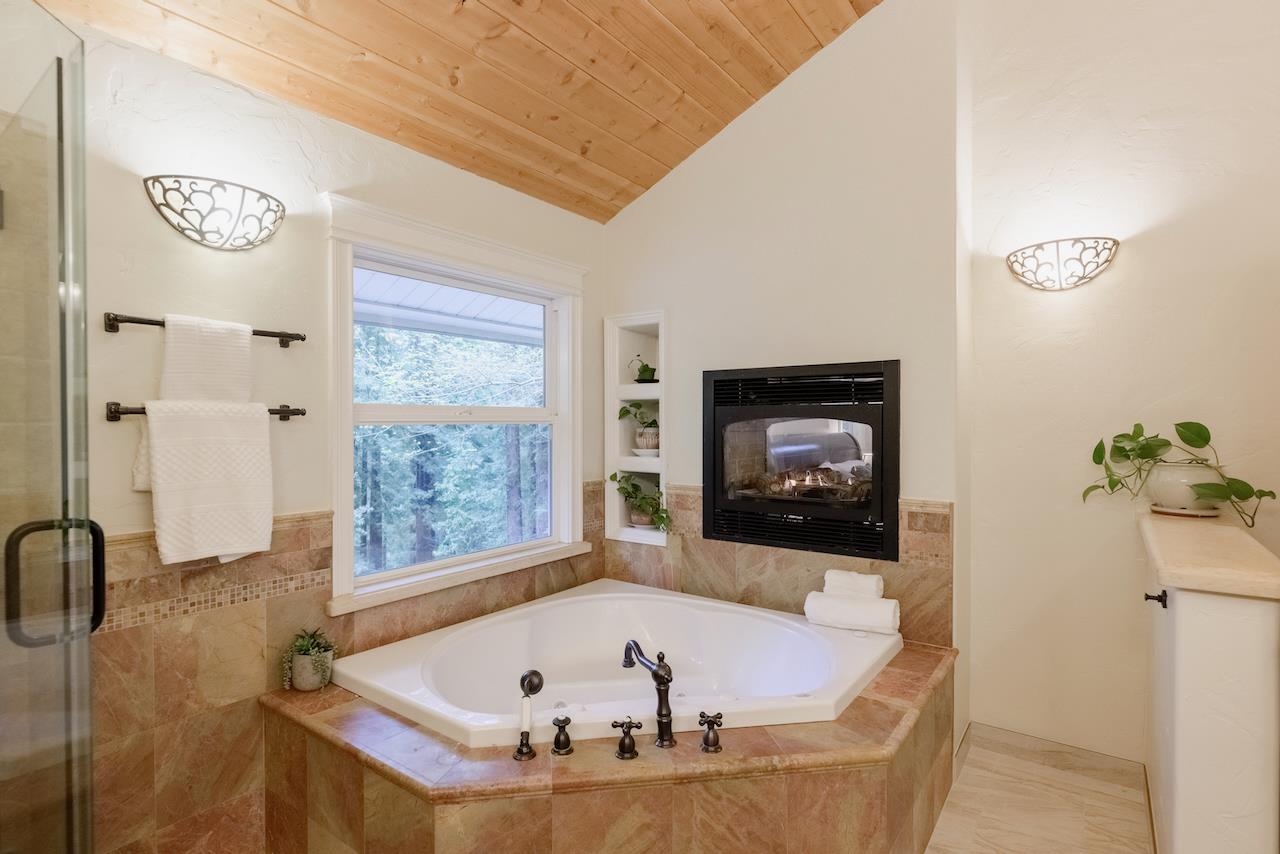 295 Jim's Road Ben Lomond, CA 95005 - Photo 68 of 139 a bath tub sitting next to a window
