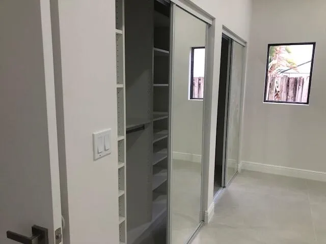 an entryway with a flower pot