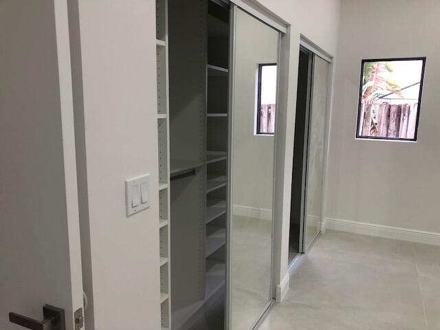 22171 Hollyhock Trail Boca Raton, FL 33433 - Photo 11 of 24 an entryway with a flower pot