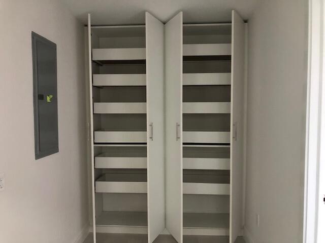 22171 Hollyhock Trail Boca Raton, FL 33433 - Photo 22 of 24 a view of walk in closet with empty racks