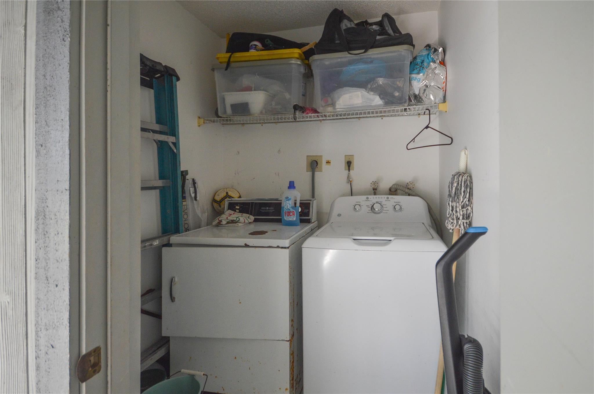 9499 West McNab Road, Unit 208 Tamarac, FL 33321 - Photo 12 of 19 a utility room with dryer and washer