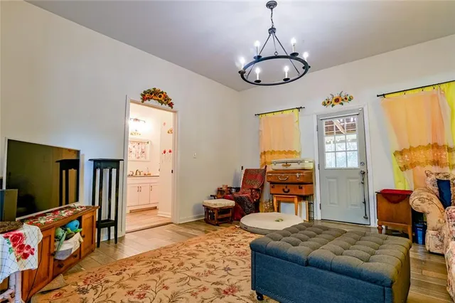 a bedroom with furniture and a window