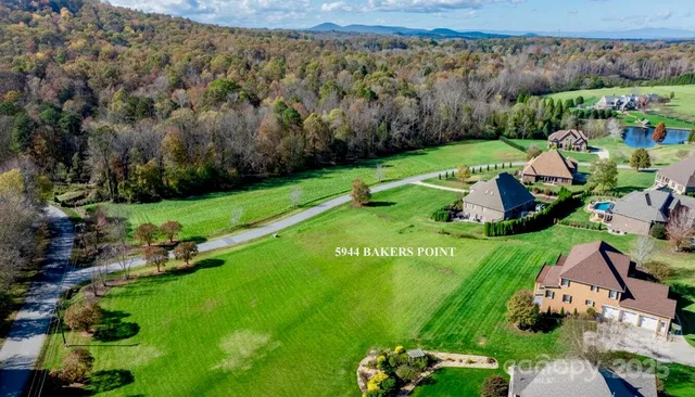 an aerial view of a golf course with chairs