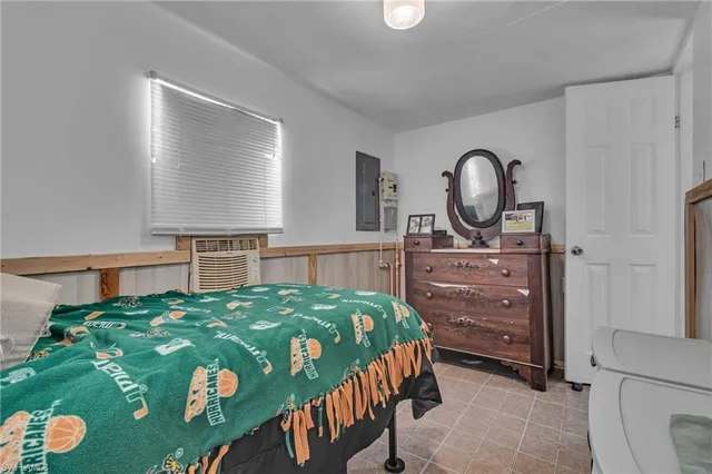 a bedroom with a bed and a table