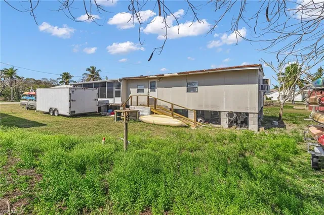 a house view with a sitting space and garden