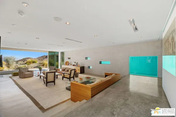 a kitchen that has a lot of cabinets in it and wooden floors