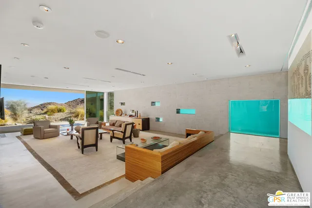 a kitchen that has a lot of cabinets in it and wooden floors
