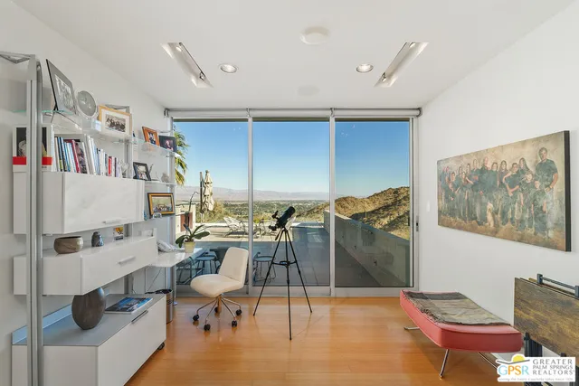 a view of a balcony with a potted plants