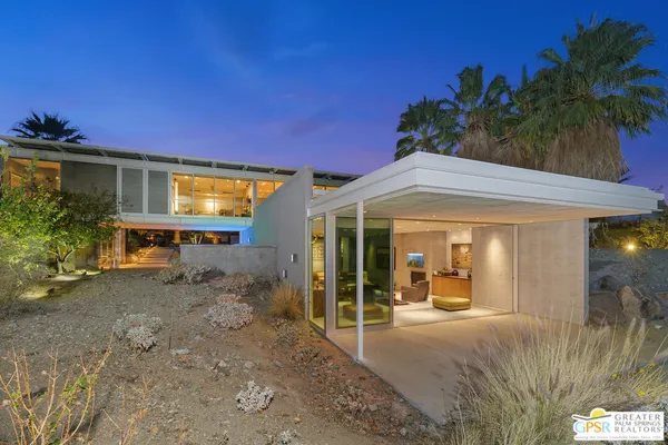 a view of a patio with swimming pool table and chairs