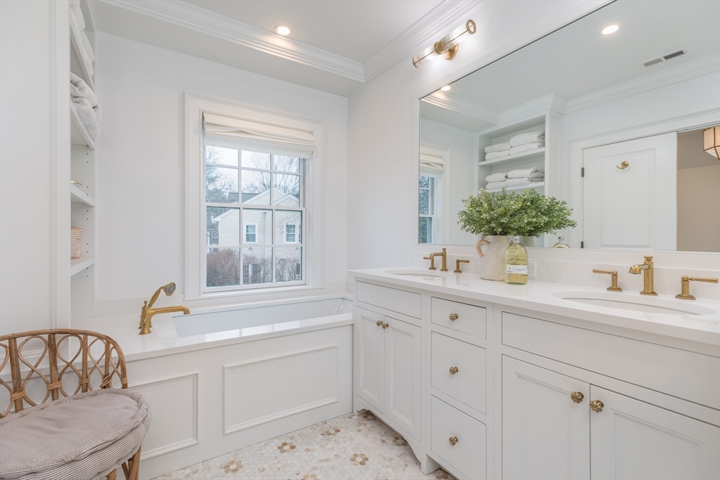 34 Chesterton Road Wellesley, MA 02481 - Photo 17 of 36 a bathroom with a sink and a window
