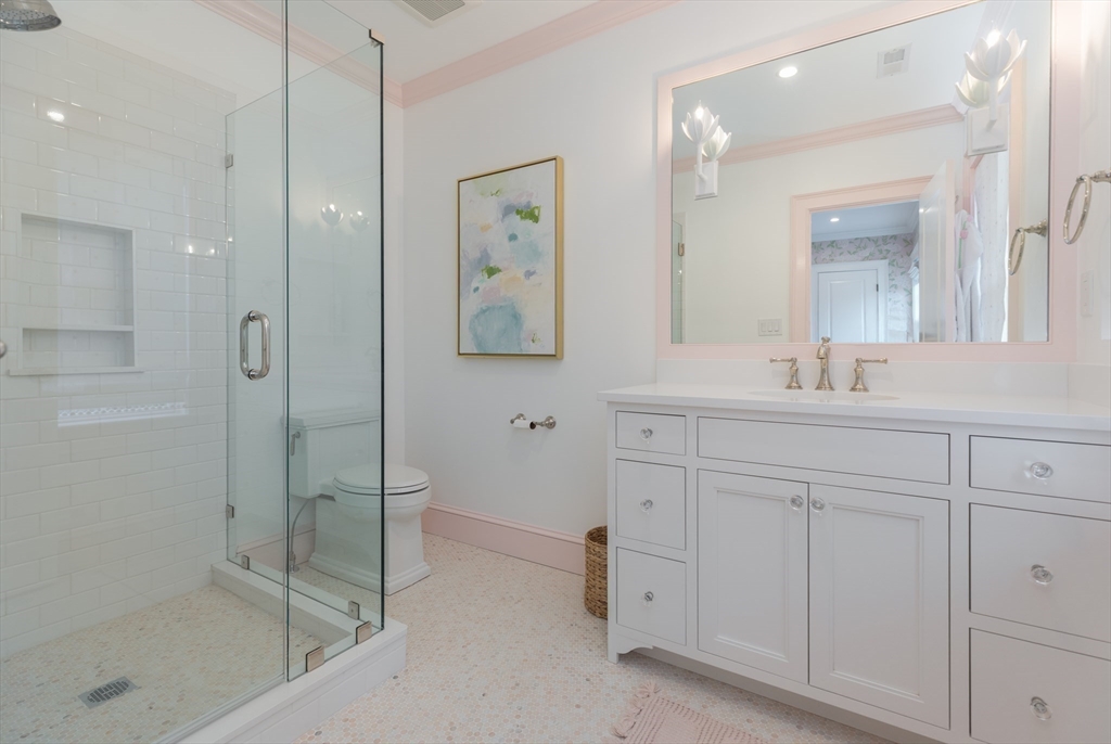 34 Chesterton Road Wellesley, MA 02481 - Photo 22 of 36 a bathroom with a shower sink and mirror