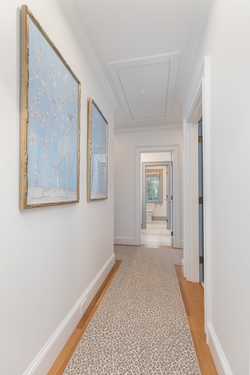 34 Chesterton Road Wellesley, MA 02481 - Photo 25 of 36 a view of a hallway with wooden floor and a bathroom