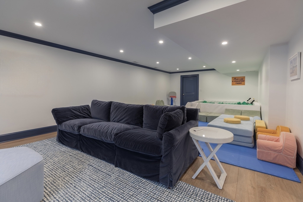 34 Chesterton Road Wellesley, MA 02481 - Photo 29 of 36 a living room with furniture and a wooden floor