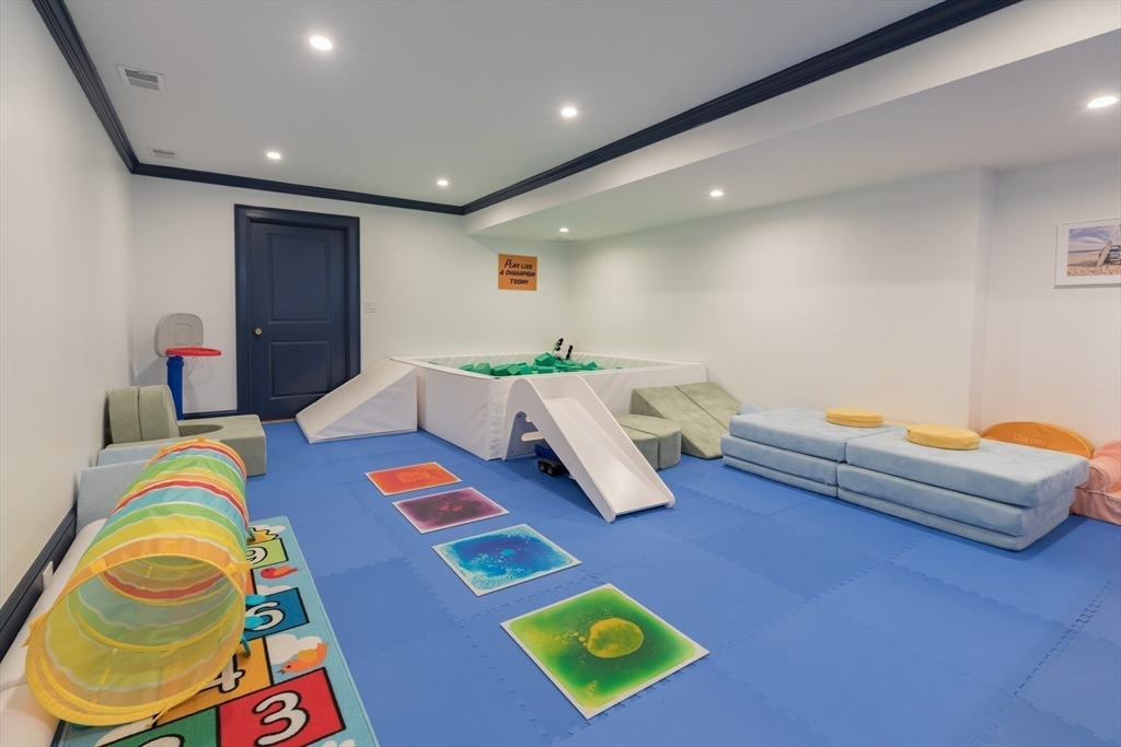 34 Chesterton Road Wellesley, MA 02481 - Photo 31 of 36 a living room with furniture and a wooden floor