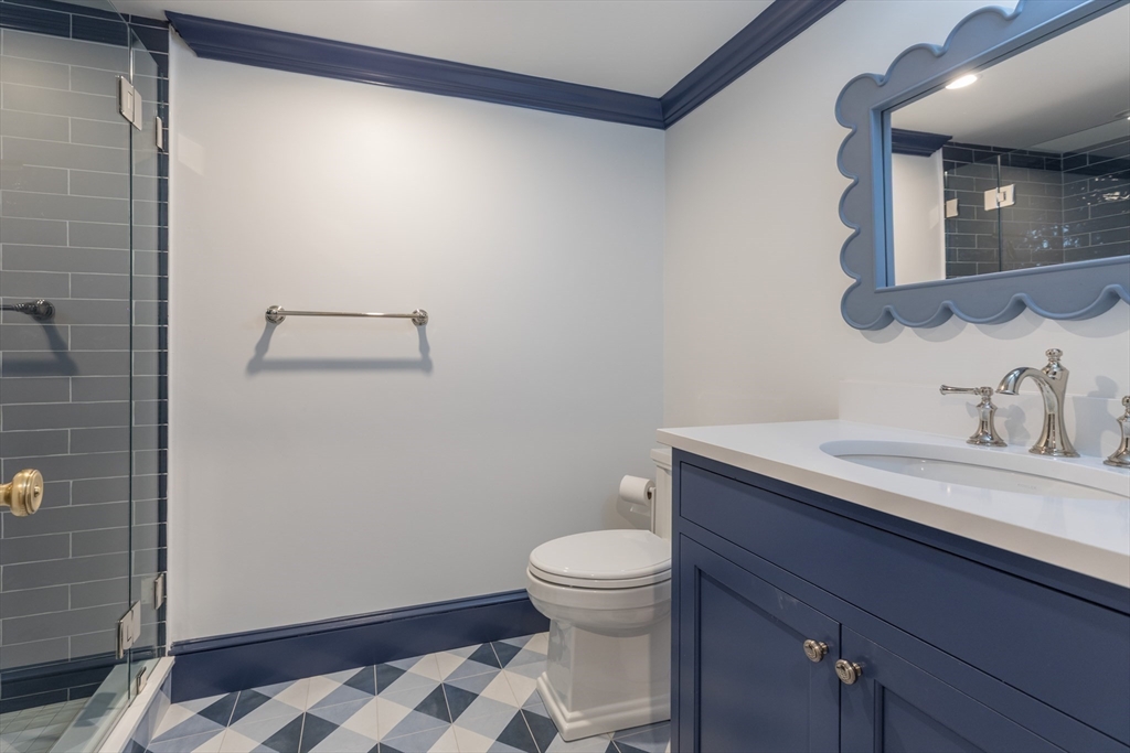 34 Chesterton Road Wellesley, MA 02481 - Photo 33 of 36 a bathroom with a granite countertop sink toilet and shower