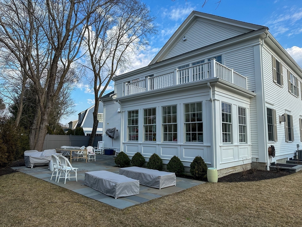 34 Chesterton Road Wellesley, MA 02481 - Photo 34 of 36 front view of a house with a yard