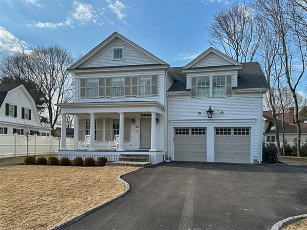 34 Chesterton Road Wellesley, MA 02481 - Photo 36 of 36 a front view of a house with a yard