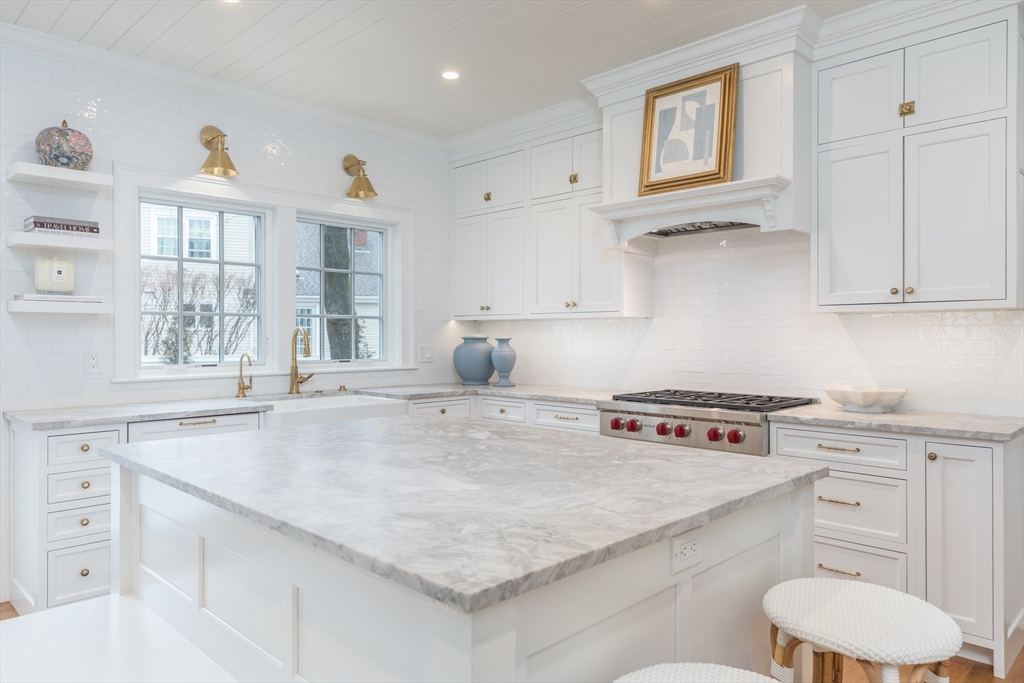 34 Chesterton Road Wellesley, MA 02481 - Photo 4 of 36 a kitchen with stainless steel appliances granite countertop a sink stove and cabinets