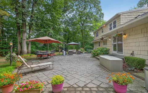 a view of a chair and table in the patio
