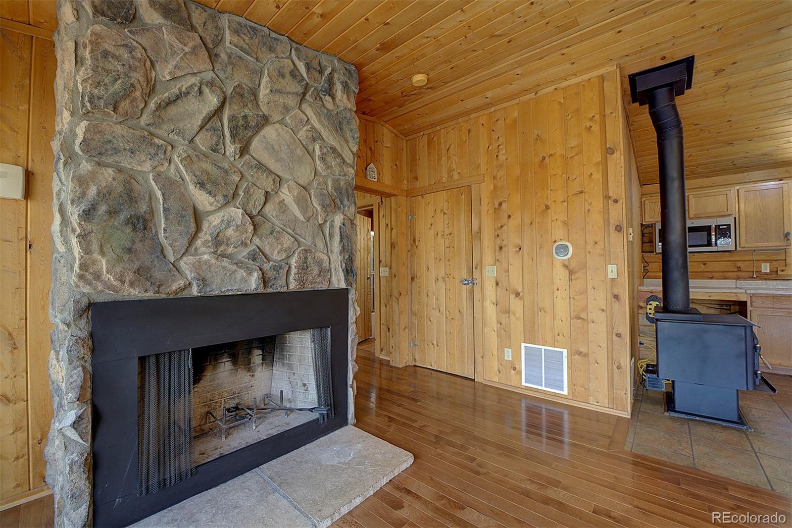 1536 Clark Road Bailey, CO 80421 - Photo 14 of 33 a view of an entryway door with wooden floor