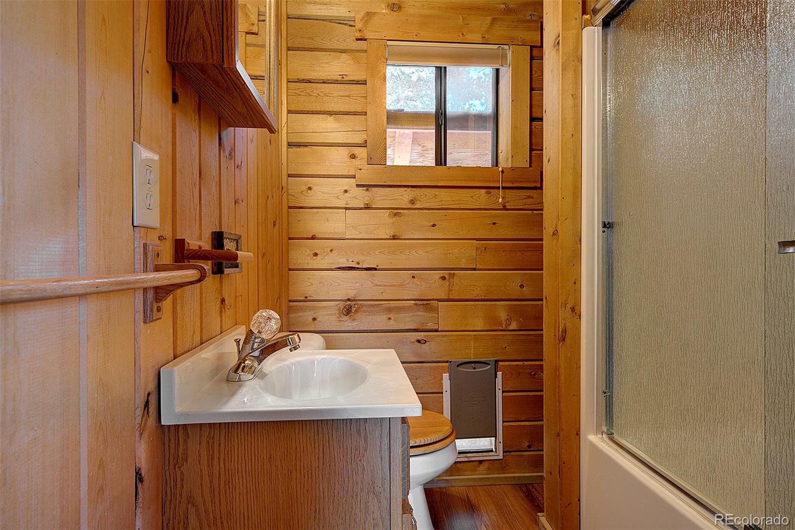 1536 Clark Road Bailey, CO 80421 - Photo 21 of 33 a bathroom with a sink and a mirror