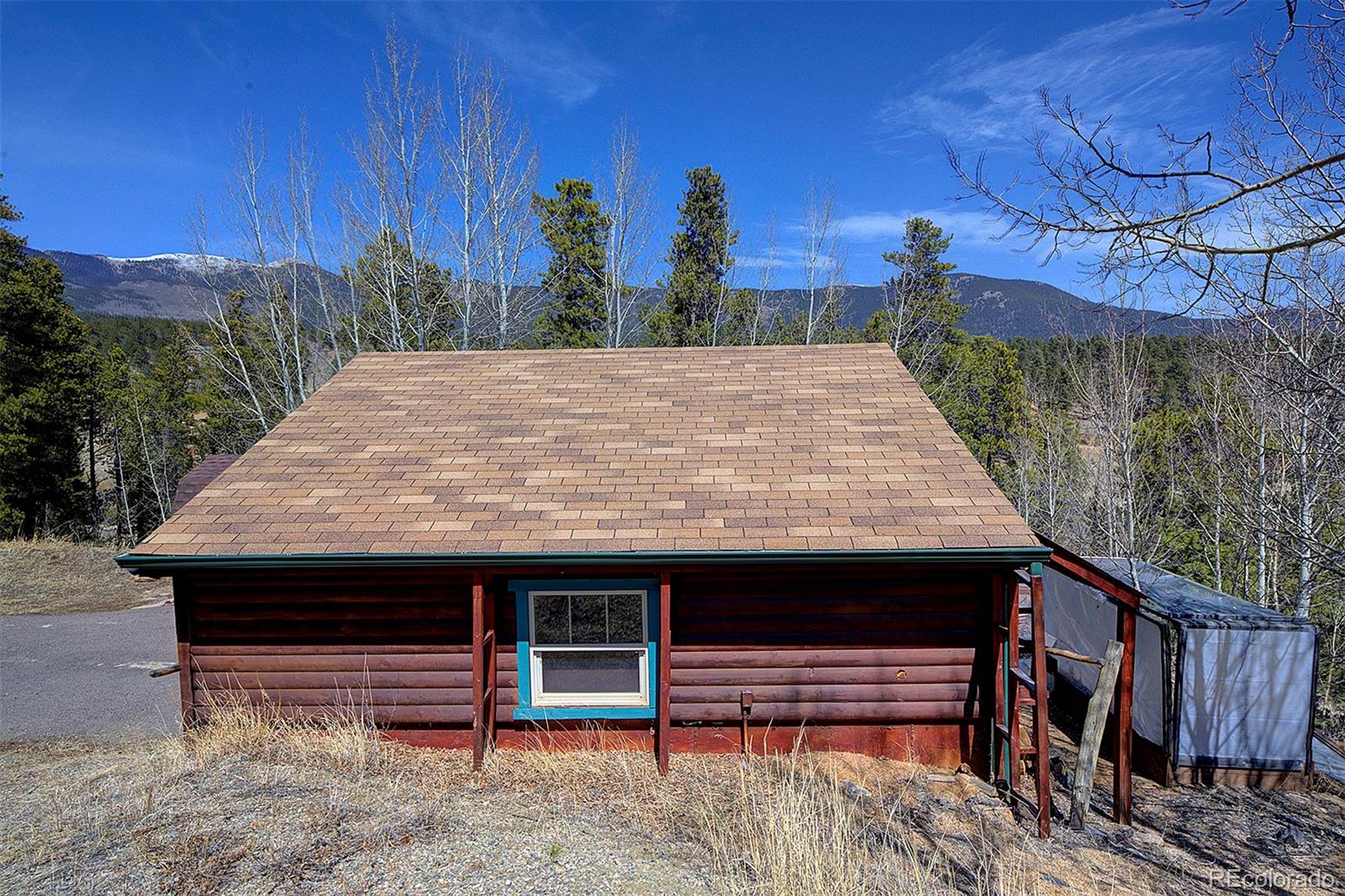 1536 Clark Road Bailey, CO 80421 - Photo 22 of 33 a view of a wooden floor with a bench in front of it