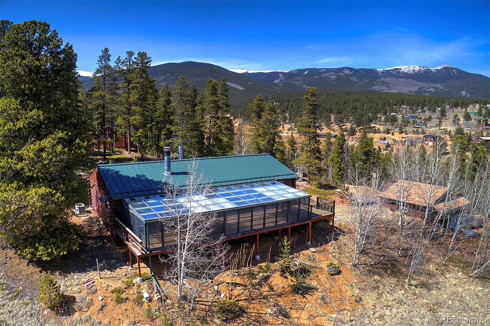 1536 Clark Road Bailey, CO 80421 - Photo 32 of 33 a view of a terrace with a table and chairs and potted plants