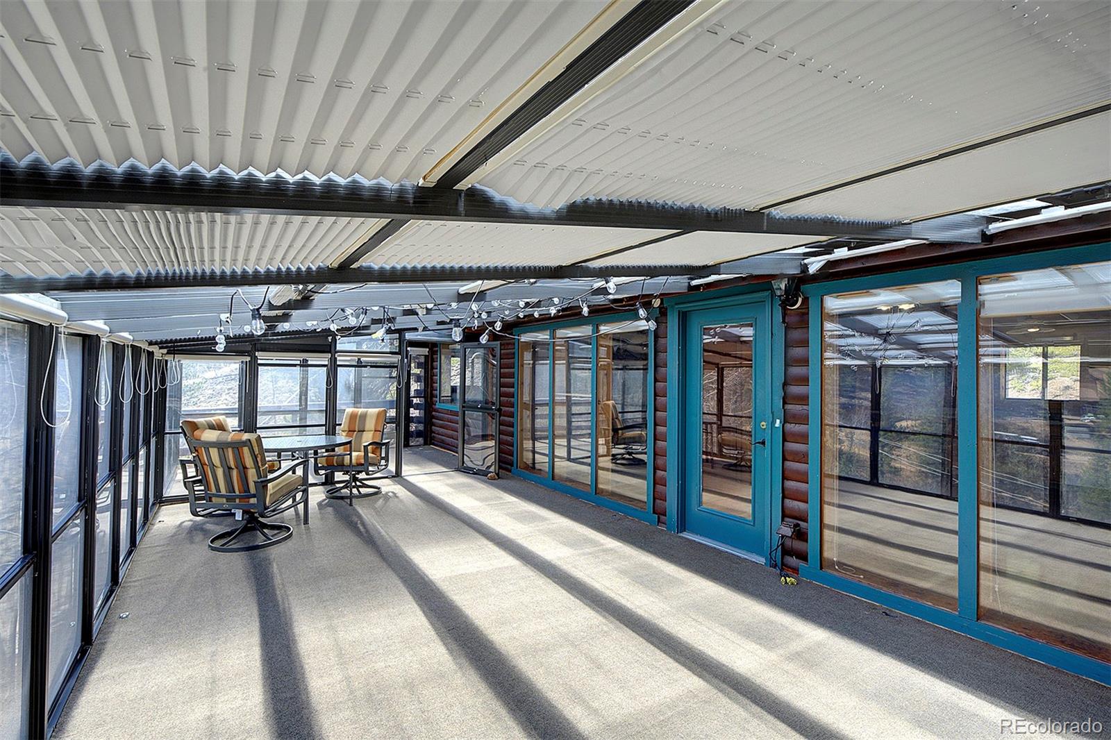 1536 Clark Road Bailey, CO 80421 - Photo 6 of 33 a view of a patio with table and chairs
