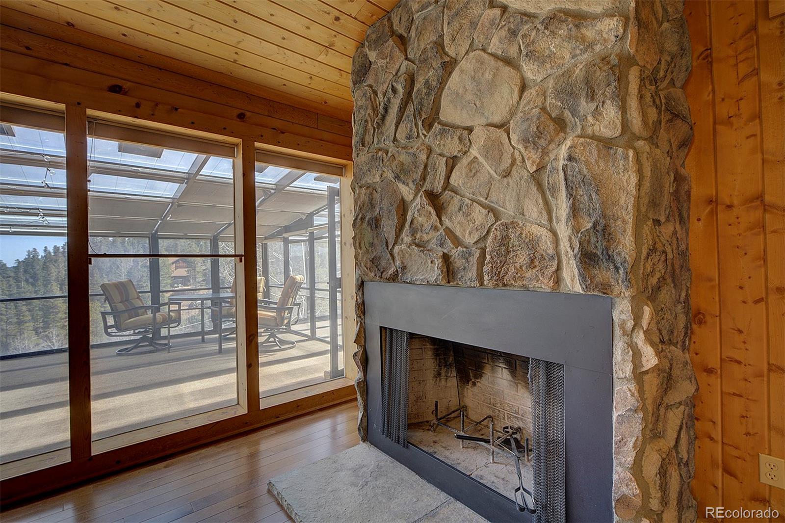 1536 Clark Road Bailey, CO 80421 - Photo 8 of 33 a view of a room that has a large window