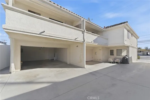 a view of a house with a garage and a fireplace
