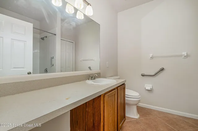 a white bath tub sitting next to a shower