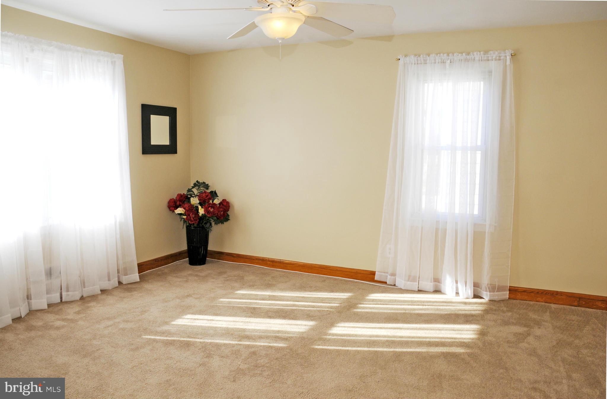 606 Cleveland Road Linthicum Heights, MD 21090 - Photo 13 of 24 a view of a livingroom with a furniture and a window