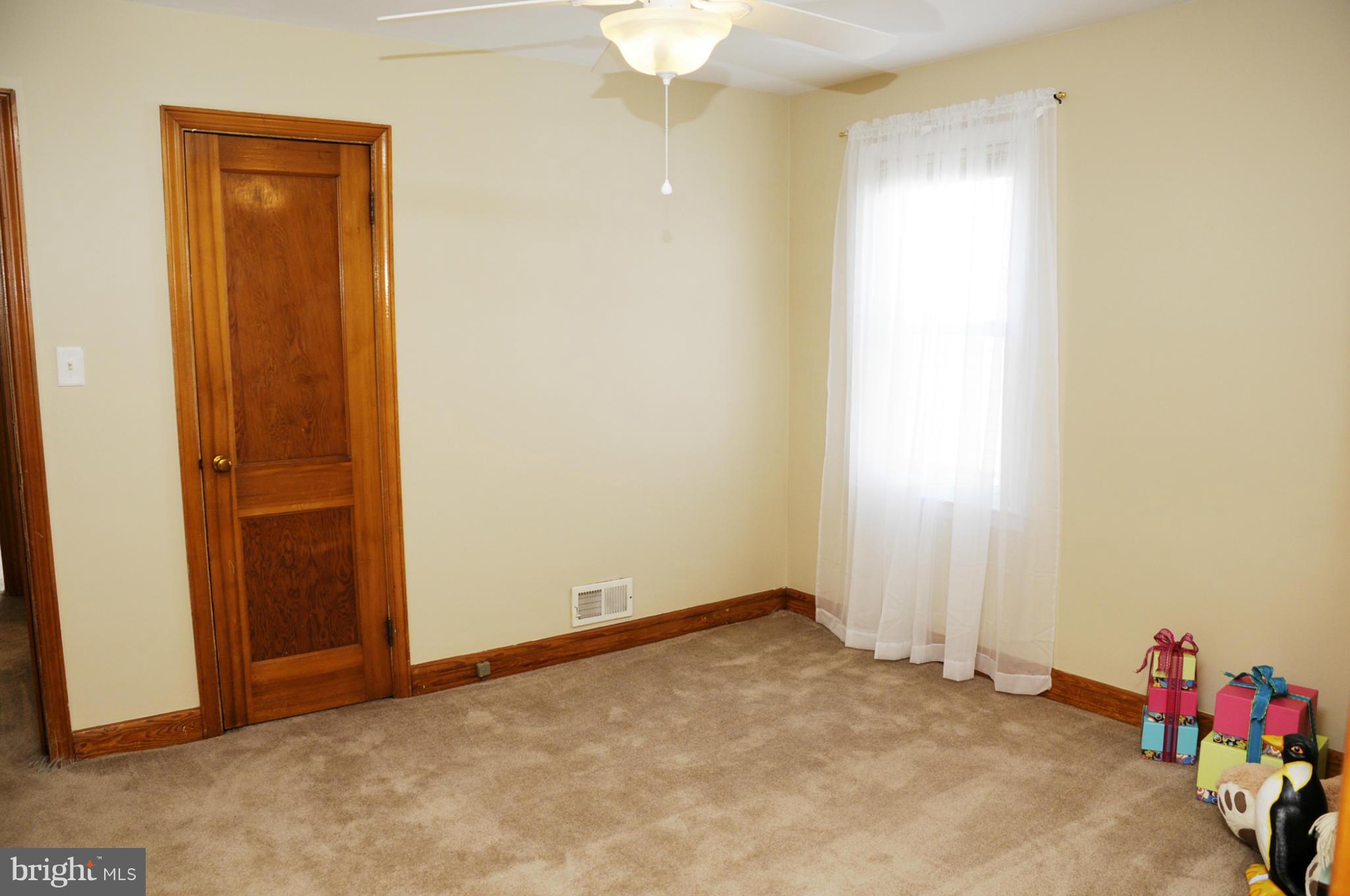 606 Cleveland Road Linthicum Heights, MD 21090 - Photo 14 of 24 an empty room with closet and a chandelier fan