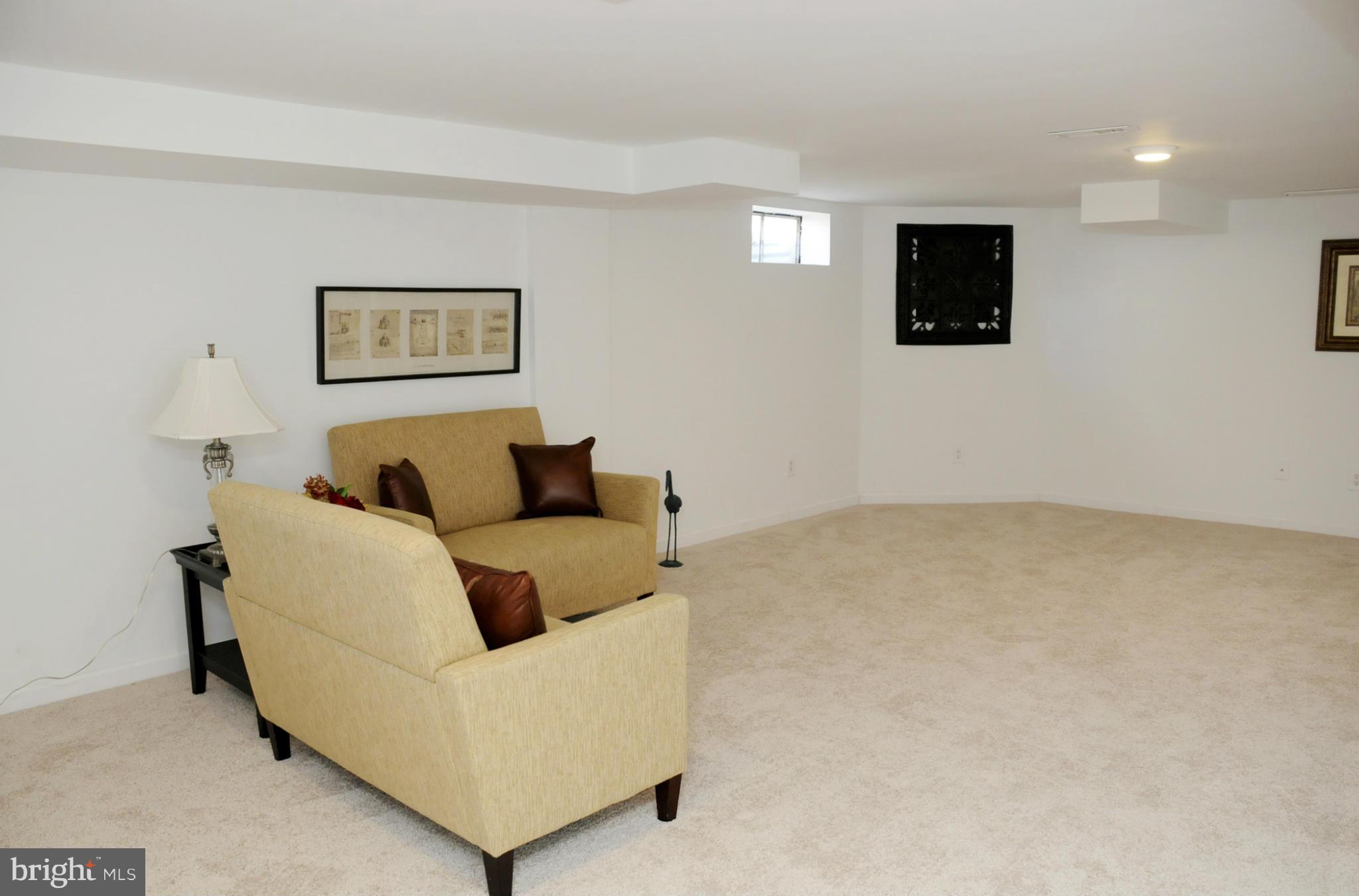 606 Cleveland Road Linthicum Heights, MD 21090 - Photo 17 of 24 a living room with furniture and a flat screen tv