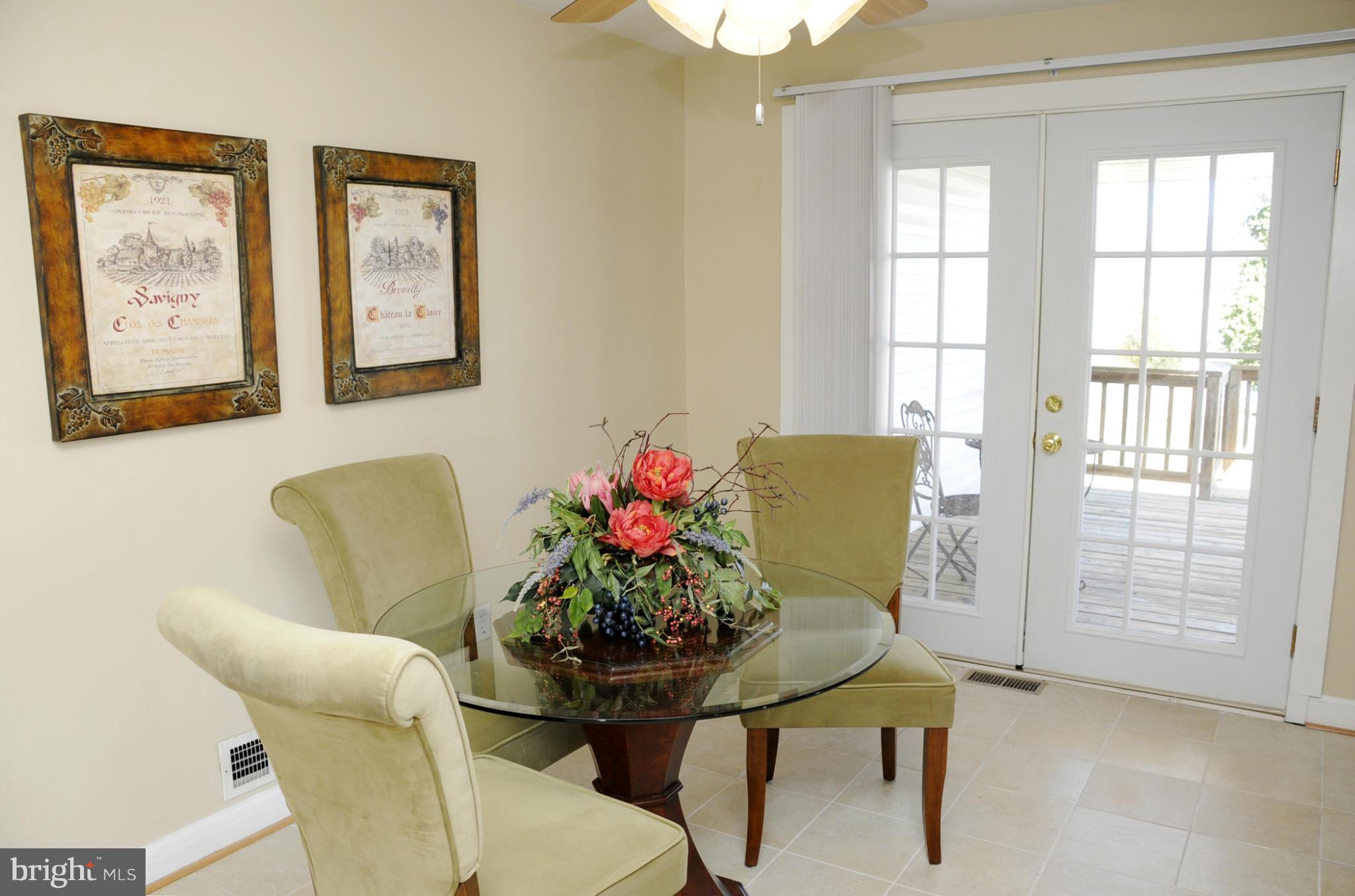 606 Cleveland Road Linthicum Heights, MD 21090 - Photo 3 of 24 a view of a dining room with furniture and a window