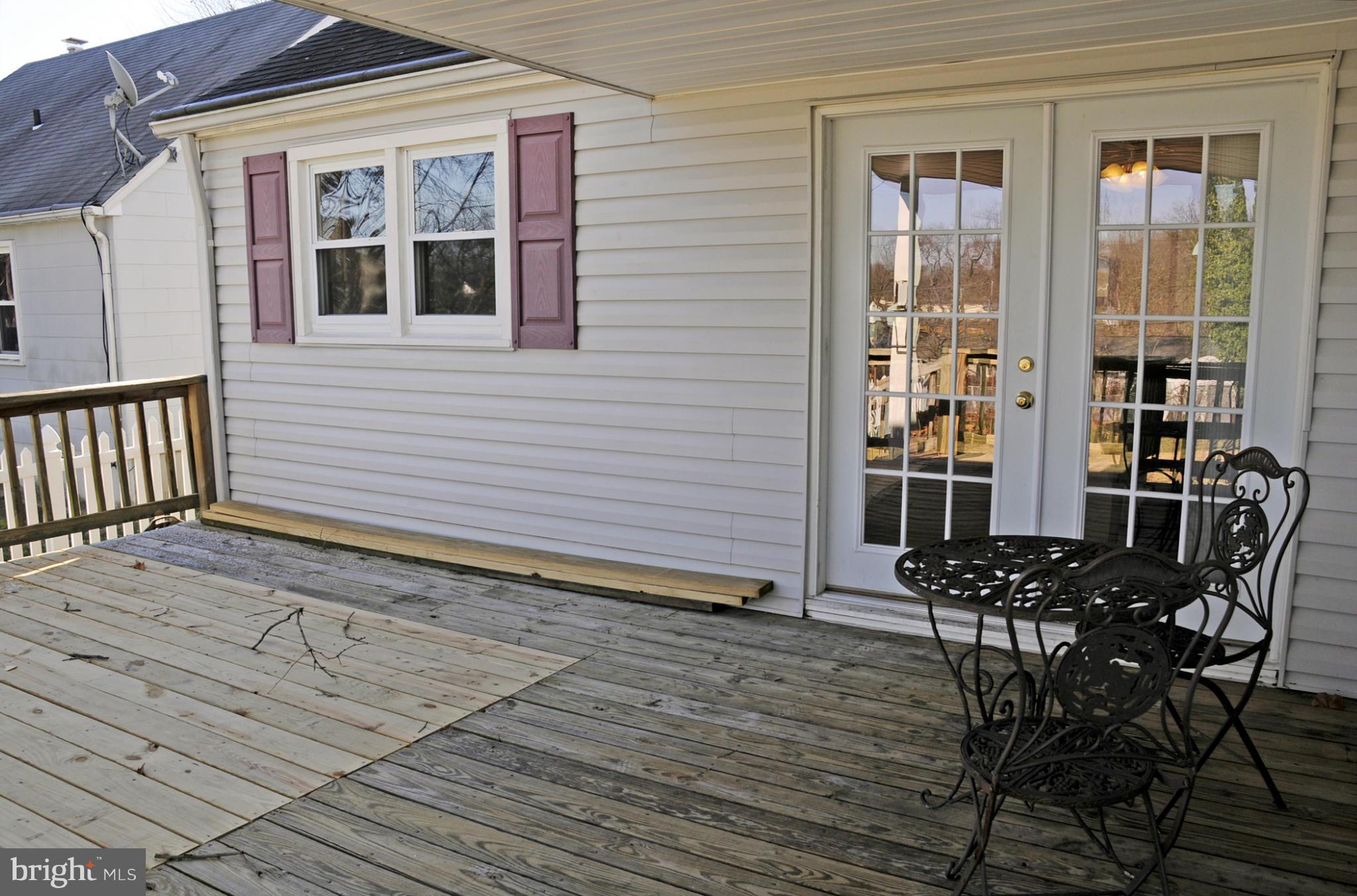 606 Cleveland Road Linthicum Heights, MD 21090 - Photo 22 of 24 a view of a wooden chairs on the deck