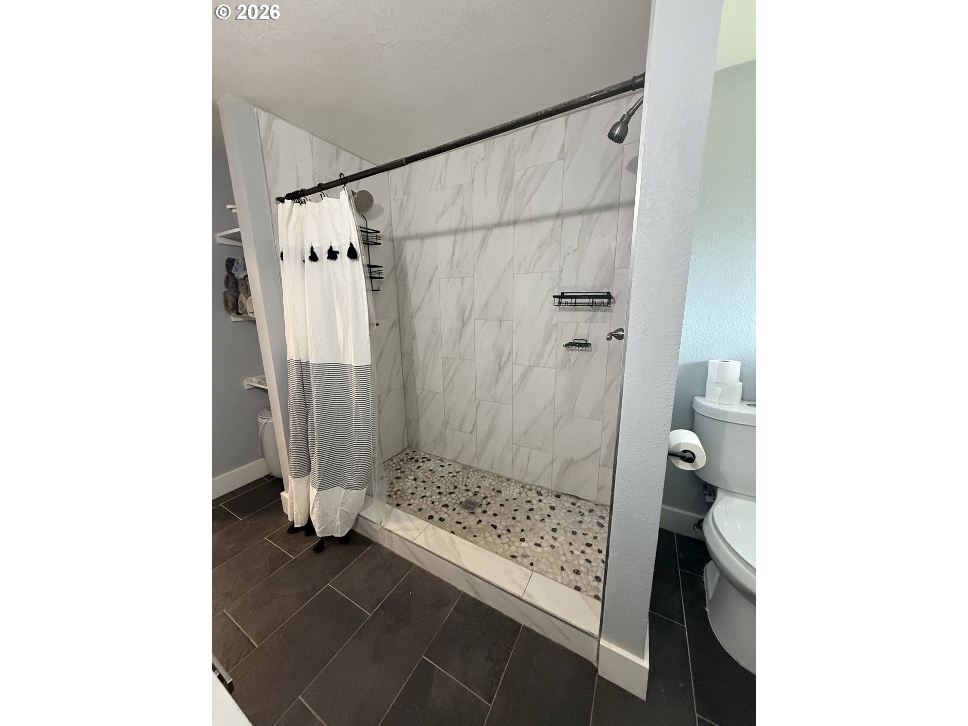 6974 Glacier Drive Springfield, OR 97478 - Photo 16 of 37 a bathroom with a sink and a shower